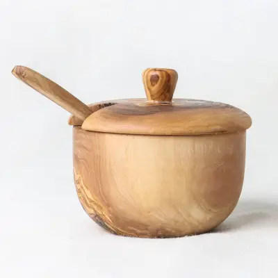 olive wood salt cellar with lift-off lid and a spoon