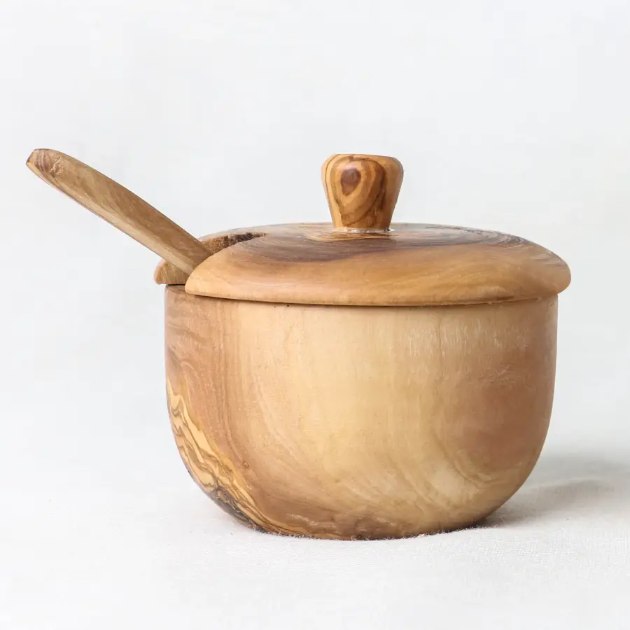 olive wood salt cellar with lift-off lid and a spoon