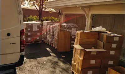 Strapped export pallets of olive wood orders being loaded