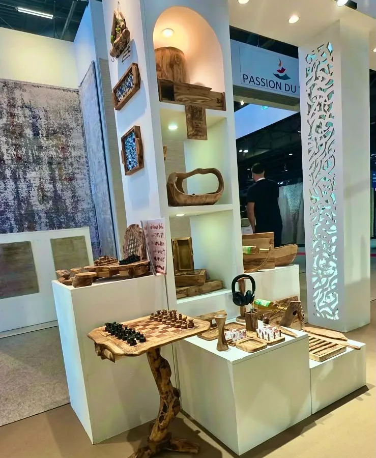 The ArtisRaw corner at Maison&Objet Paris 2026, with a live-edge olive wood chess table, desk pieces and wall-mounted trays shown to visiting buyers
